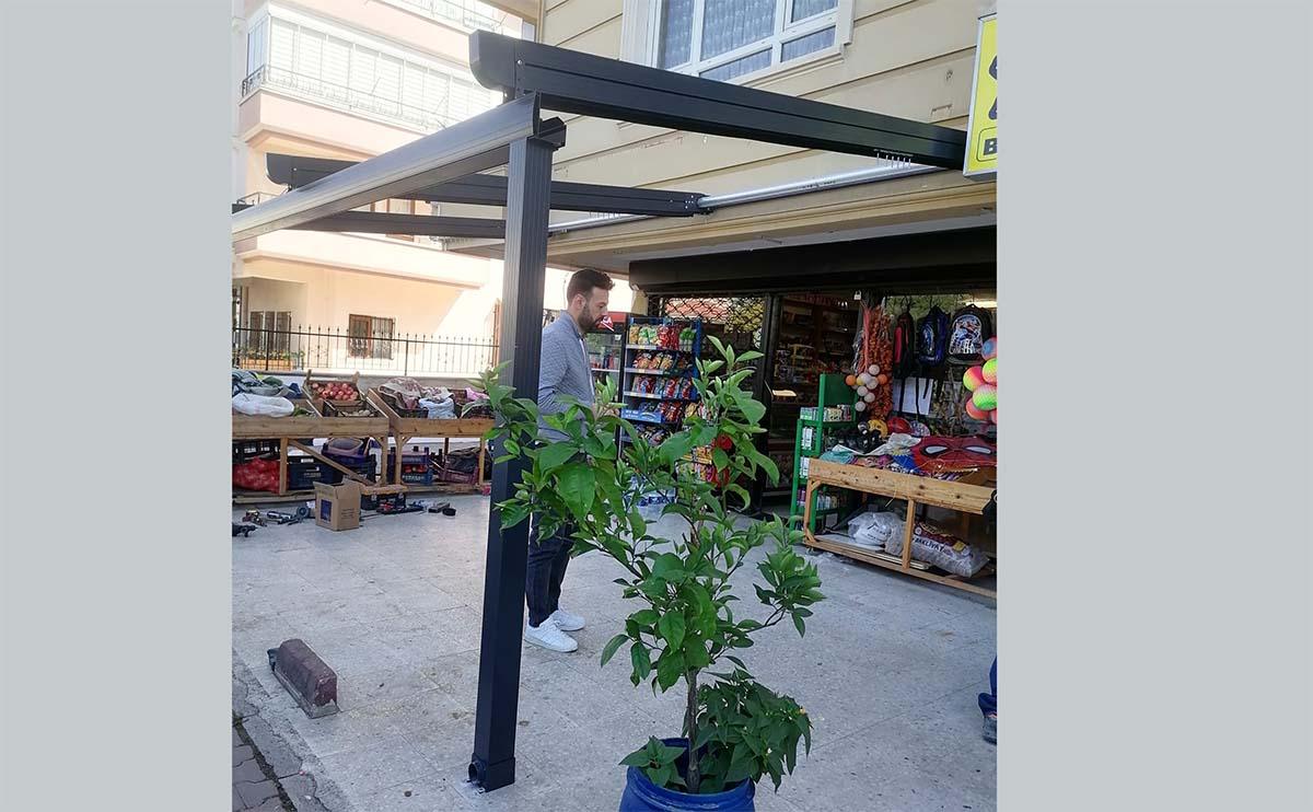 Market with canopy and potted plant